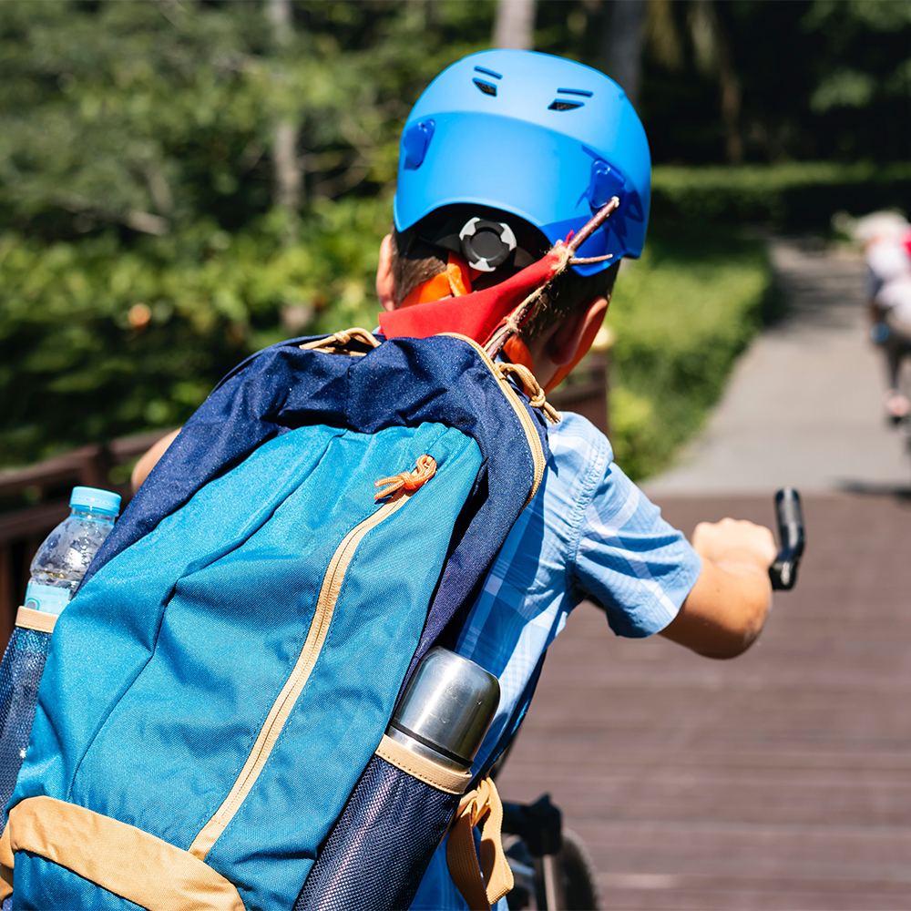 Kid biking with helmet